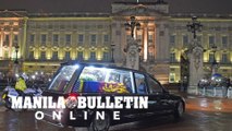 Under leaden skies, Queen Elizabeth II’s coffin returns to London