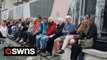 Royal fans claim their spots to watch the arrival of the coffin of Her Majesty Queen Elizabeth II at Westminster later today