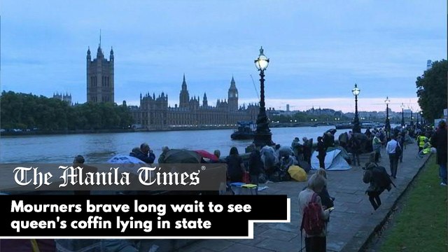 Mourners brave long wait to see queen's coffin lying in state