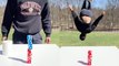 Creative genius complements his dice-stacking trick with a surprise back flip!