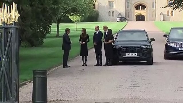 Prince William gestures to cautious Meghan Markle before Windsor Castle walkabout