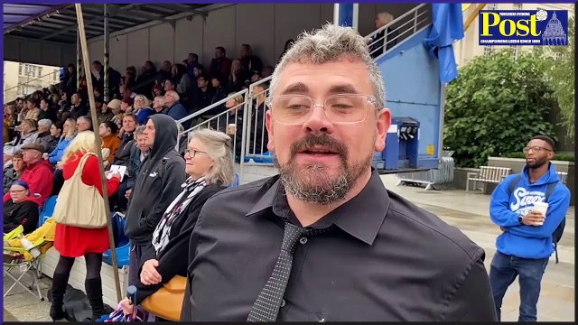 Mourners watch the Queen's funeral in Leeds' Millennium Square