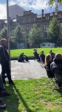 Mourners in Cathedral Gardens, Manchester watching Queen Elizabeth II's funeral
