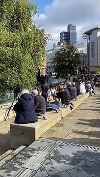 Mourners in Exchange Square, Manchester watching Queen Elizabeth II's funeral
