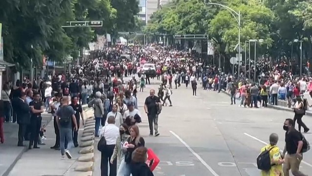 People gather in the streets of Mexico City after powerful earthquake