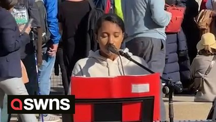 Teenager pays respects to the royal family outside Westminster Abbey with an emotional rendition of God Save the King