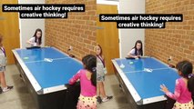 Genius little girl does a SICK impromptu trick shot while playing air hockey