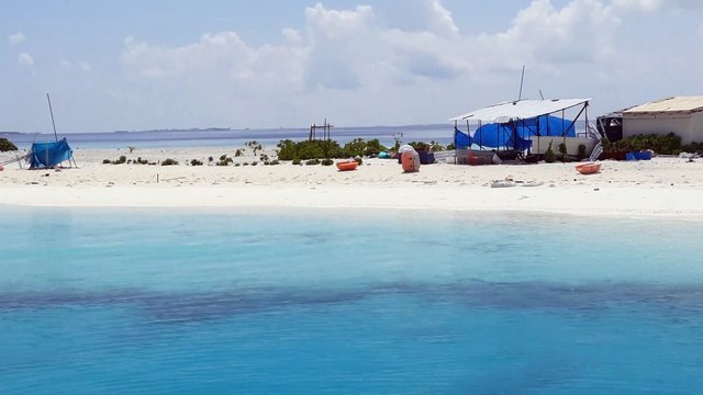 The white sand and crystal blue waters of the Maldives.