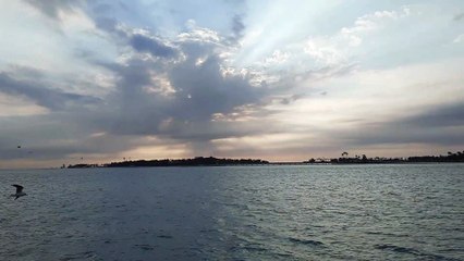 The sun setting on the Jeddah Corniche and the beautiful changing color of the sky.