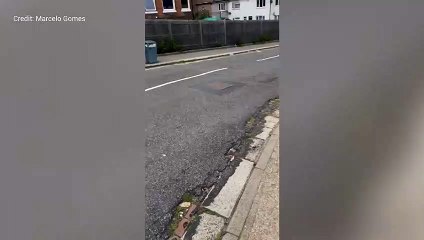 Marcelo Gomes shows the damage to his car