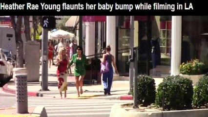 Heather Rae Young flaunts her baby bump while filming in LA