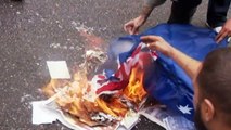 Protesters burn flags calling for the end of the monarchy