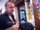 Ali Hakim cutting his woman celebrity client's hair at salon in India, answers mobile during haircut