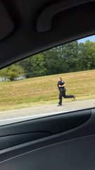 Cops Chase Down Man in Traffic and Tackle Him Against Barricade