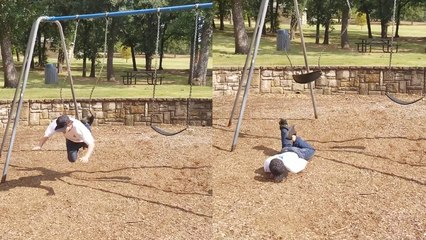 Boy tries to jump over swing but gets his foot caught in it and falls down