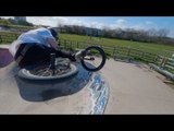 BMX Rider Rides Bike Across Skatepark