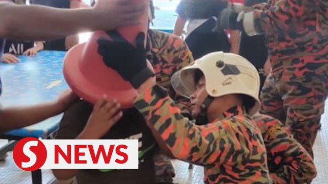 Firefighters rescue boy after cone gets stuck on head