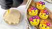 Chef captivatingly frosts cookie with smiley wearing a daisy crown
