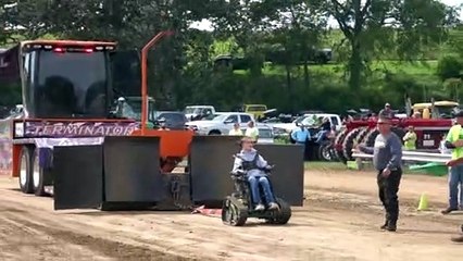 Disabled Kid Pulls Tractor in Wheelchair