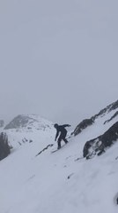 Snowboarder Smoothly Rides Down Snowy Hill