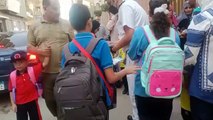 ضباط مرور المحلة يوزعون أدوات مدرسية على أبناء الشهداء وطلبة المدارس