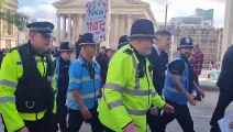 Business Secretary Jacob Rees Mogg escorted past protesters in Birmingham city centre as he makes his way to the Conservative Party Conferece at the ICC