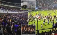 Thousands of Indonesian football fans carry candles during vigil for the 125 killed during horrific soccer riot after hooligans sparked scenes of anarchy by storming the pitch when their side lost