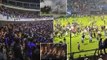 Thousands of Indonesian football fans carry candles during vigil for the 125 killed during horrific soccer riot after hooligans sparked scenes of anarchy by storming the pitch when their side lost