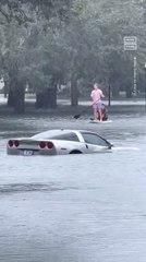 Floridians Paddle Board Through Flooded Streets, Despite Warning
