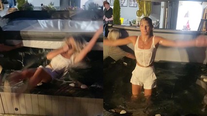 Girl carelessly falls into hot tub after downing a whole bottle of rum