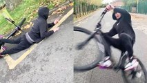 Cyclist attempting to wheelie on damp road faces hilarious fail