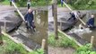 Toddler slips into muddy water after laughing at stepdad for almost going in