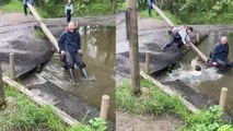 Toddler slips into muddy water after laughing at stepdad for almost going in