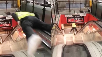 Man crazily slides down escalator's railing to kill his boredom