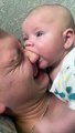 Teething baby tries to chew on dad's nose