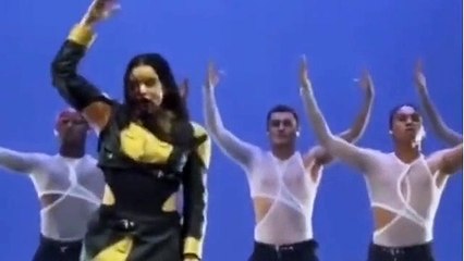 Thanks a bunch! Spanish pop star Rosalia is NOT happy as she's hit in the face by bouquet thrown onto stage during US gig