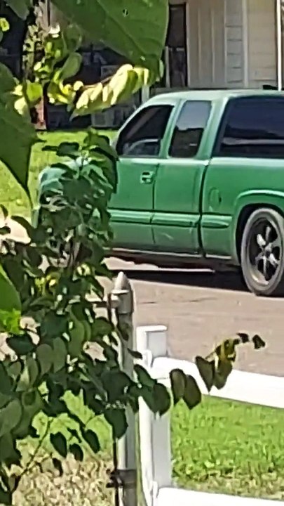 Guys Tow a Truck Using Another Truck and Jack