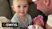 Adorable moment toddler meets baby sister for the first time and repeats 'I love you'