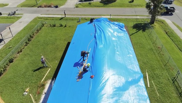 Blue roofs installed onto damaged homes in Florida