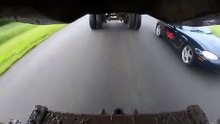 Miata driving underneath a Truck Fast and Furious things