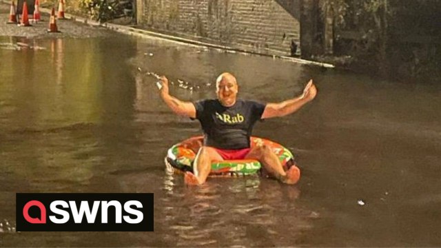 UK dad who is sick of floods near his house decides to 'embarrass the council' by taking a dip in the puddle - in a rubber ring