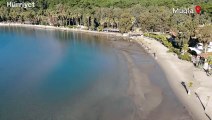 Ula ilçesindeki Akyaka sahilinde deniz suyu kıyıdan yaklaşık 20 metre çekildi