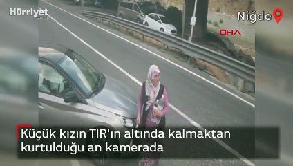 Küçük kızın TIR'ın altında kalmaktan kurtulduğu an kamerada