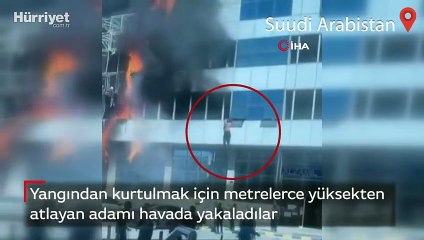 Yangından kurtulmak için metrelerce yüksekten atlayan adamı havada yakaladılar