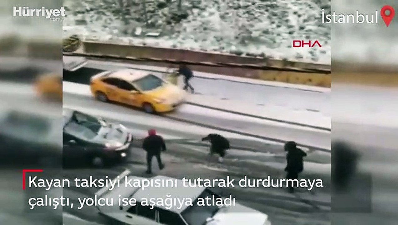 Kayan taksiyi kapısını tutarak durdurmaya çalıştı!