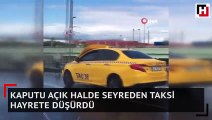 Kaputu açık halde seyreden taksi hayrete düşürdü