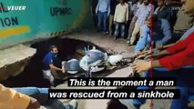 Shocking Moment Motorcyclist Survives Falling Into Sinkhole