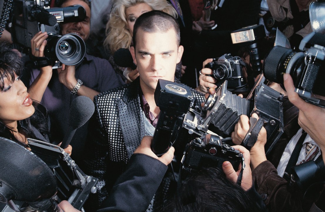 Robbie Williams releasing a 25th anniversary deluxe version of debut solo LP Life thru a Lens