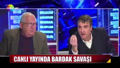 Gürcistan'daki canlı yayında bardak savaşı