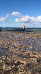 Big Wave Plows Over Man on Beach
